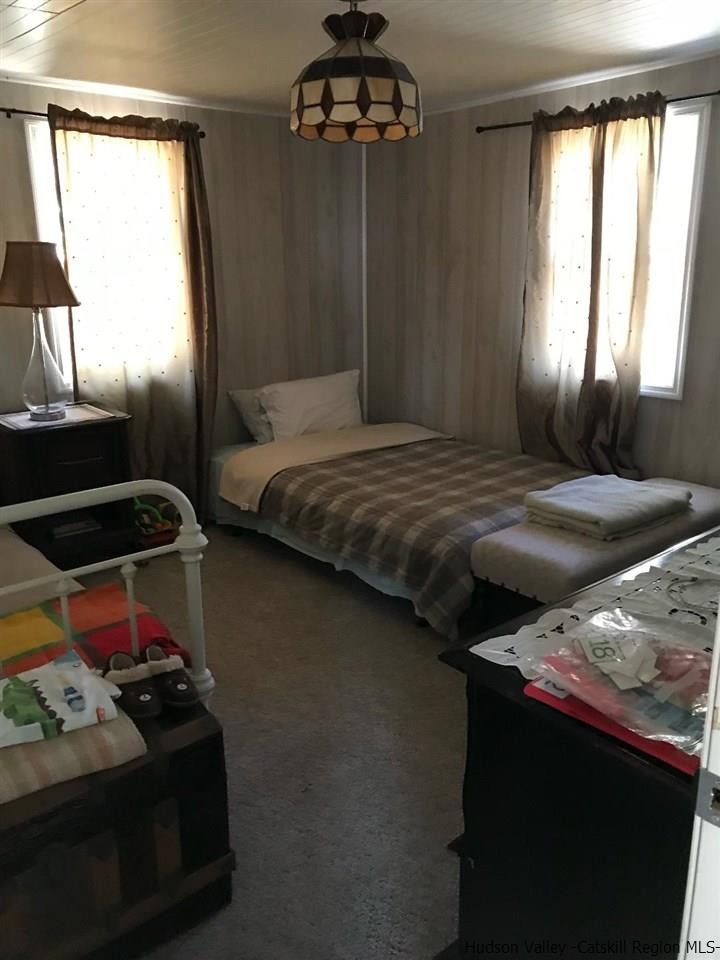 163 Churchland Road Saugerties, NY 12477 - Photo 10 of 20 a bedroom with a bed and a window