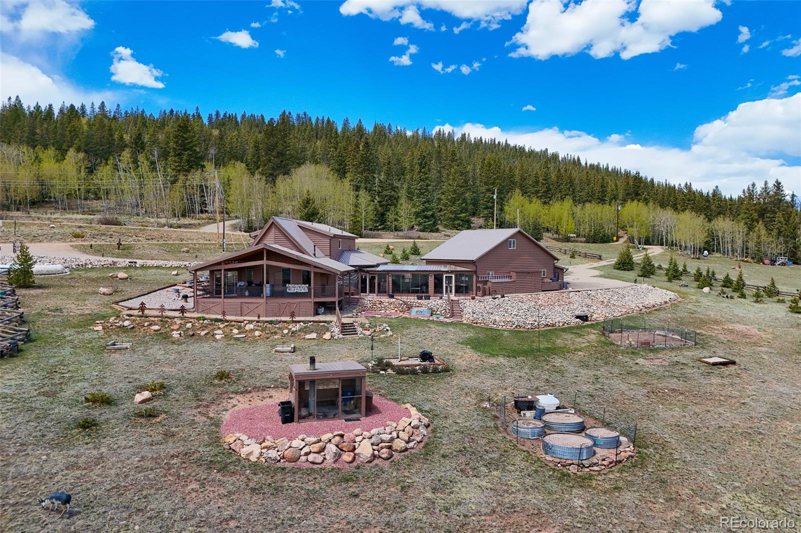 1163 Michigan Hill Road Jefferson, CO 80456 - Photo 39 of 48 a view of a house with a yard