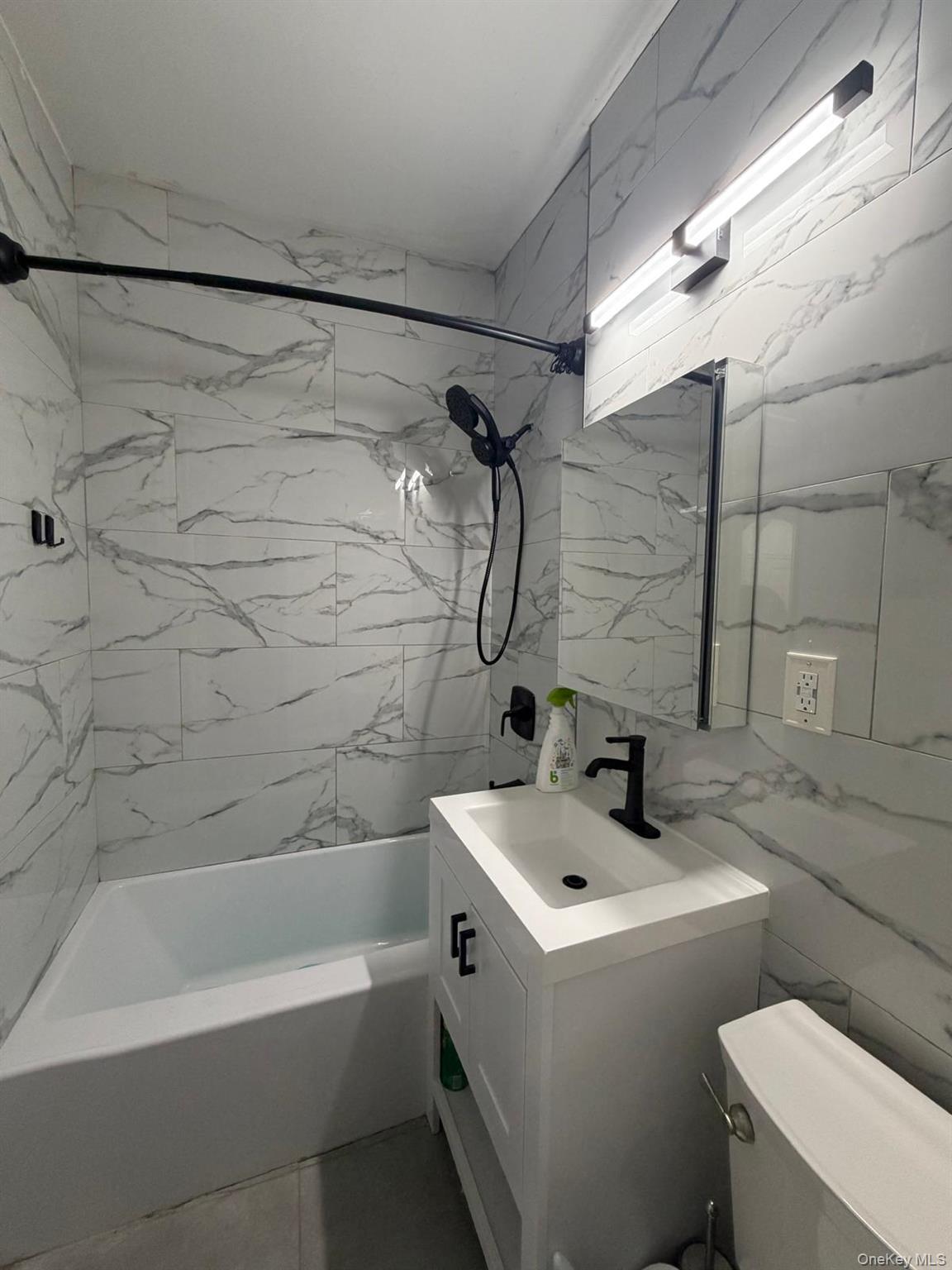 110 Stonelea Place, Unit 4A New Rochelle, NY 10801 - Photo 1 of 8 a bathroom with a sink a toilet and shower