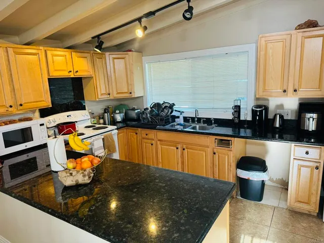 a bed room with a bed and a television