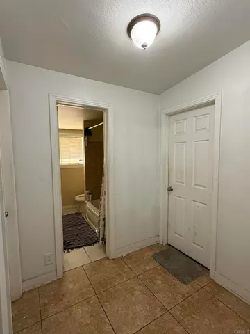 a bedroom with a bed and a chair