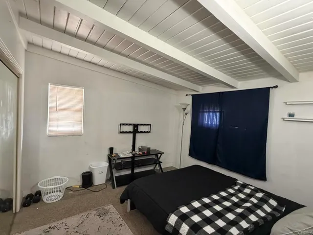 a kitchen with a sink a stove and a mirror