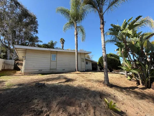 a view of a storage and utility room with racks on the wall