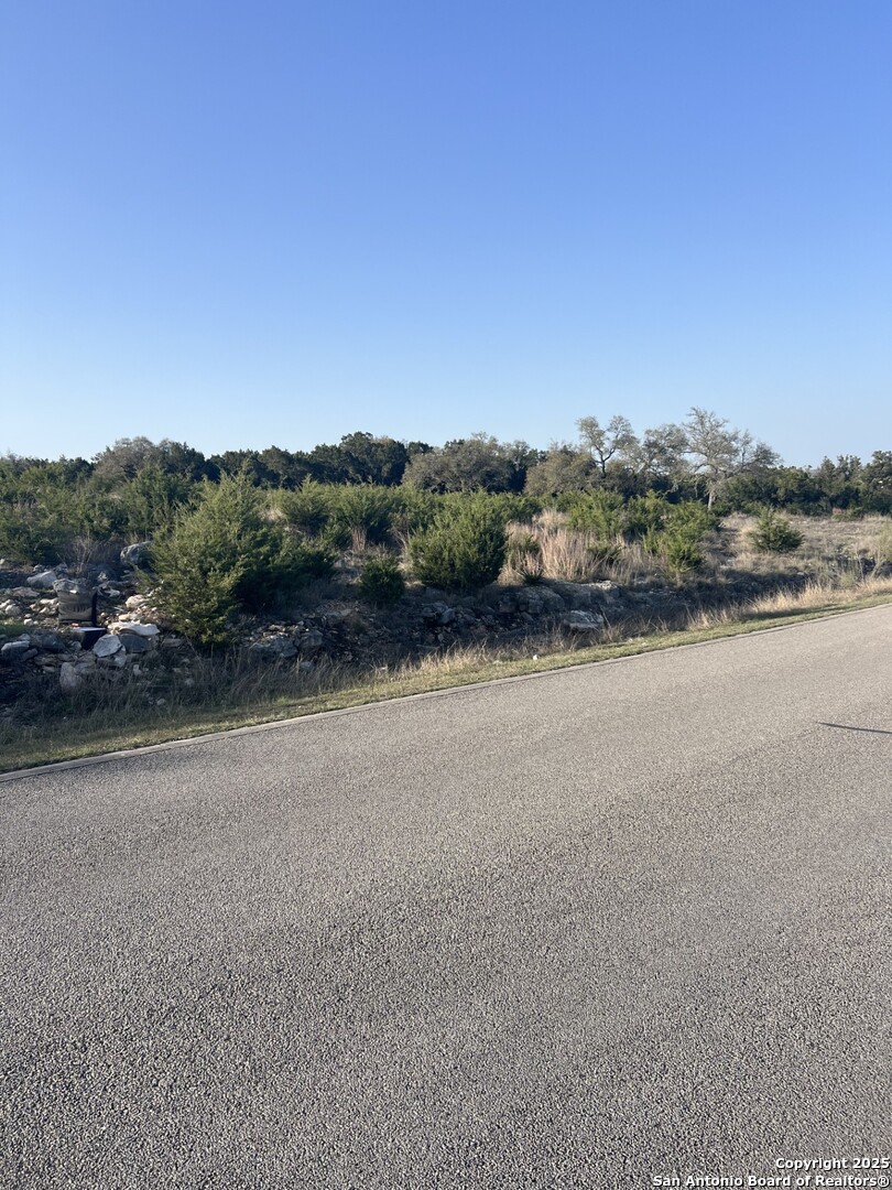 27407 Sunset Loop San Antonio, TX 78266 - Photo 3 of 36 a view of a lake with mountains in the background