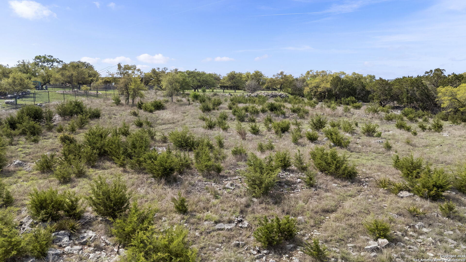 27407 Sunset Loop San Antonio, TX 78266 - Photo 32 of 36 a view of a city with lush green forest