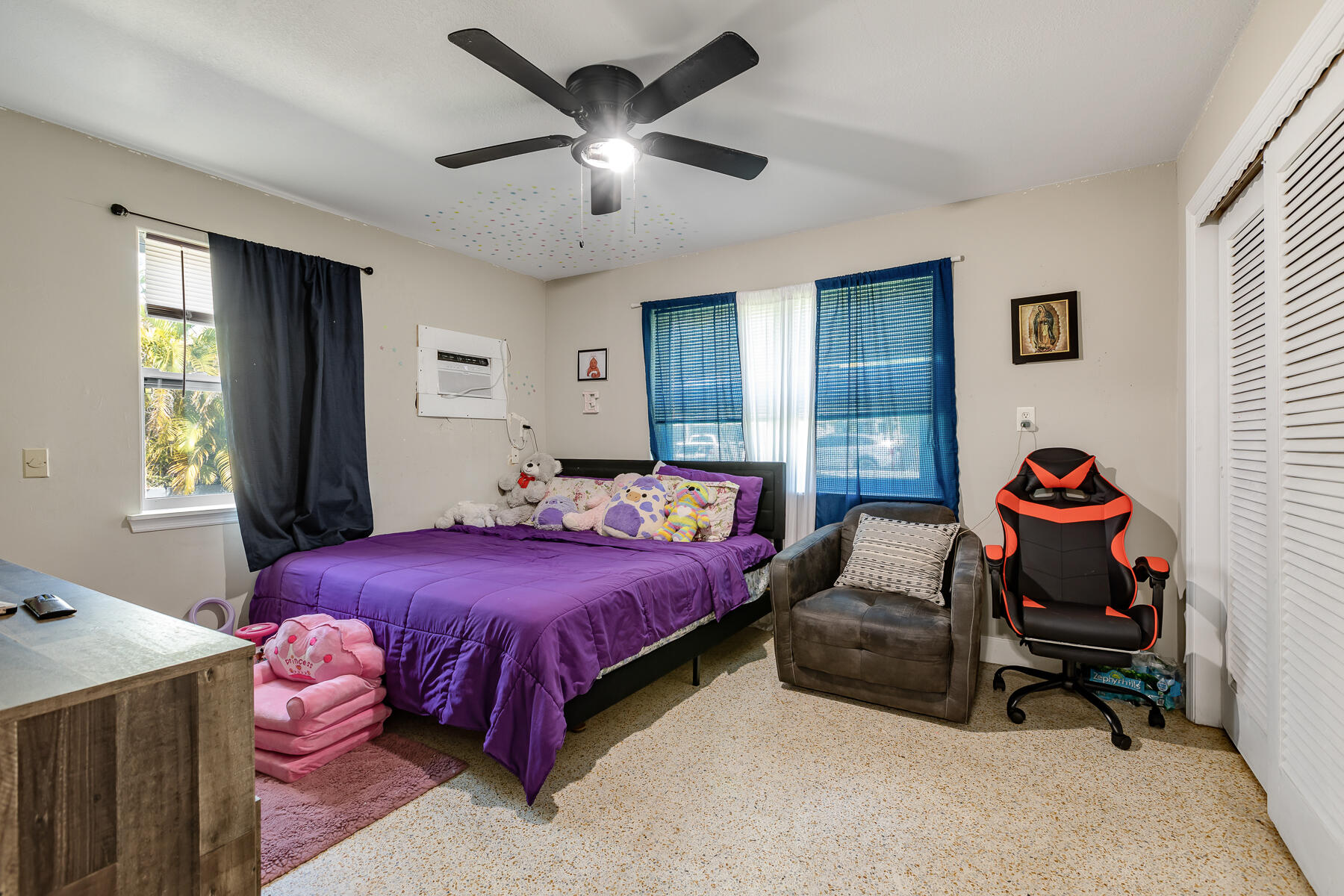 201 4th Street Key West, FL 33040 - Photo 13 of 19 a bedroom with a bed and a chandelier