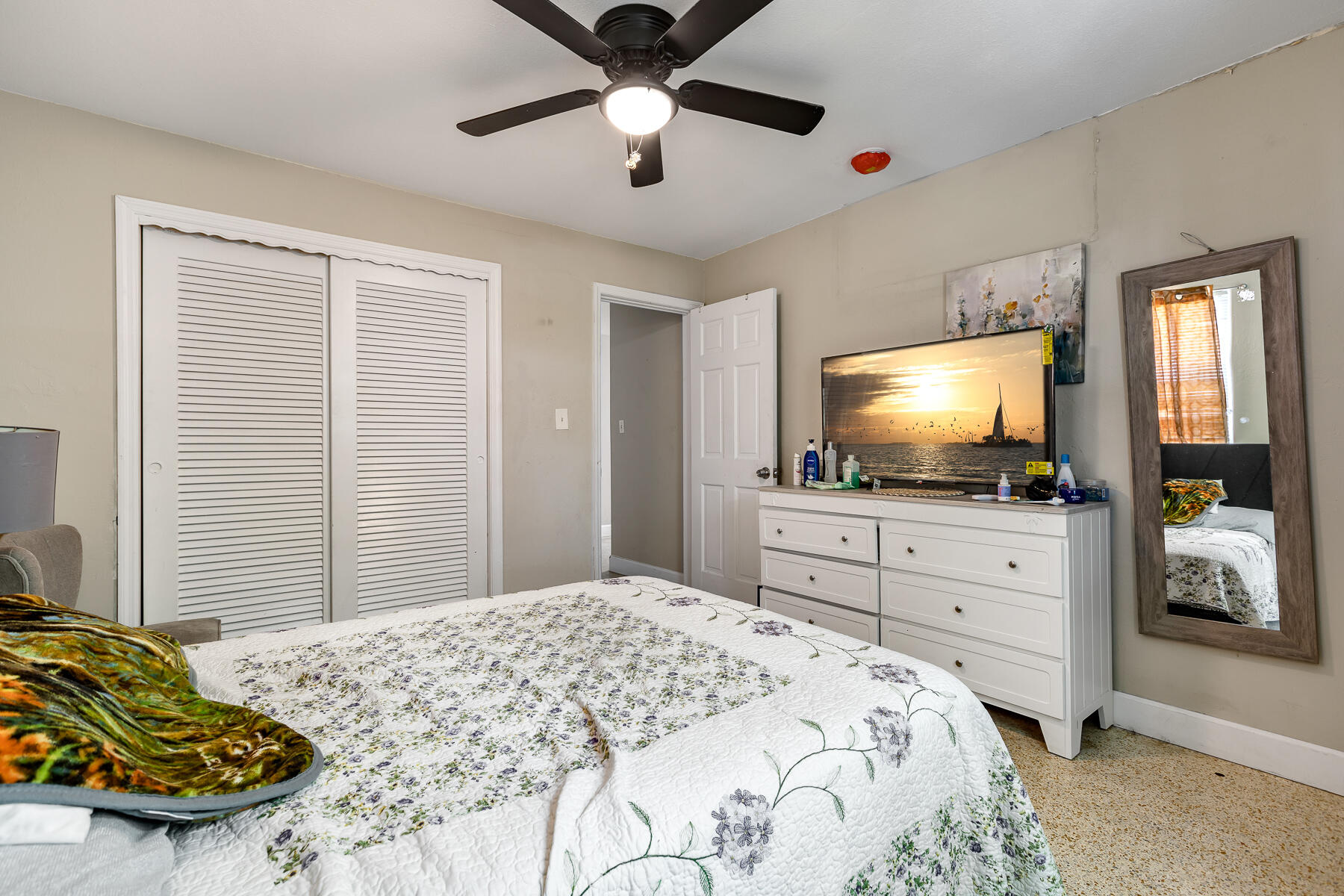 201 4th Street Key West, FL 33040 - Photo 17 of 19 a bedroom with a bed and a flat screen tv in it