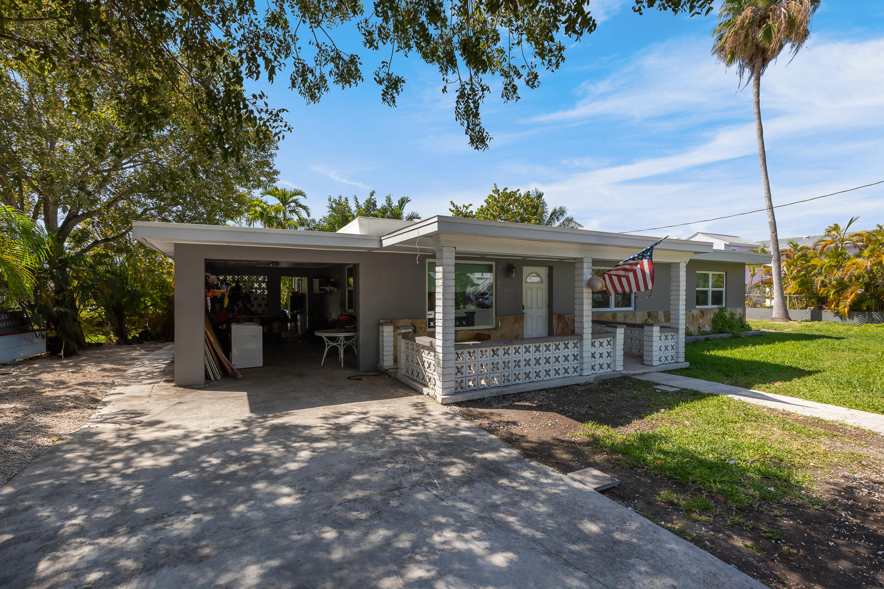 201 4th Street Key West, FL 33040 - Photo 2 of 19 a view of a house with a yard and tree s