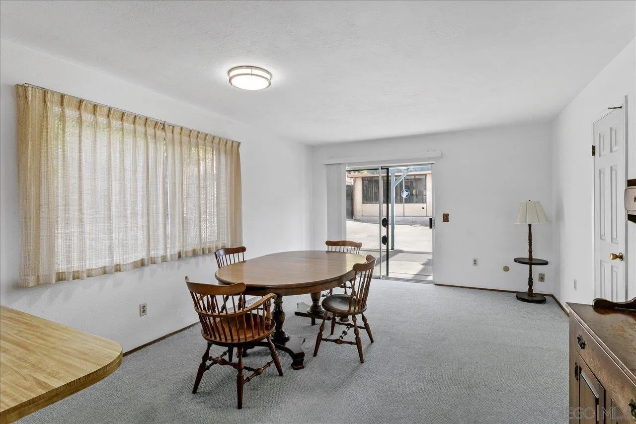1221 Virginia Way La Jolla, CA 92037 - Photo 11 of 27 a dining room with furniture and window