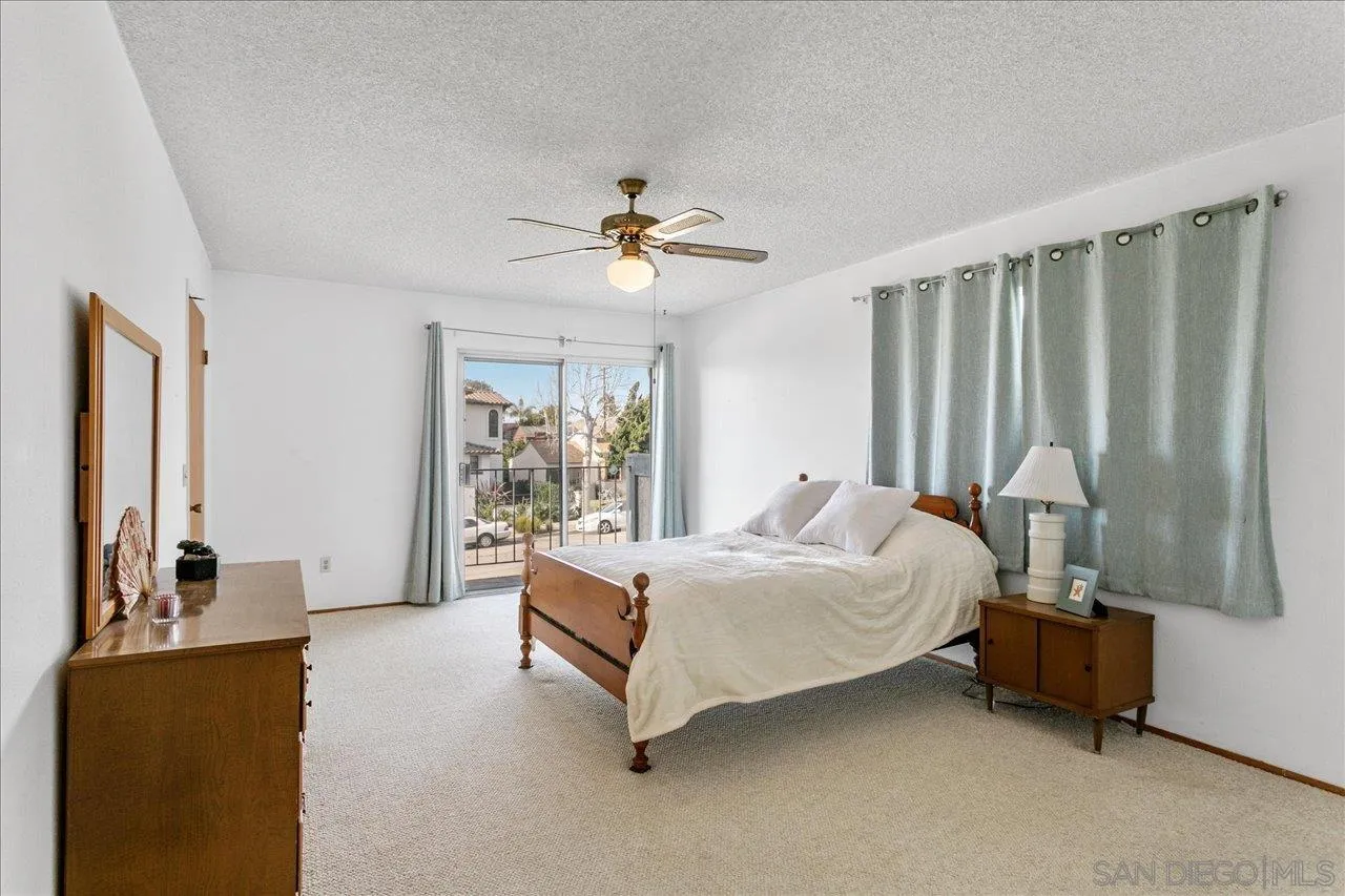 1221 Virginia Way La Jolla, CA 92037 - Photo 14 of 27 a bed room with a bed and a couch