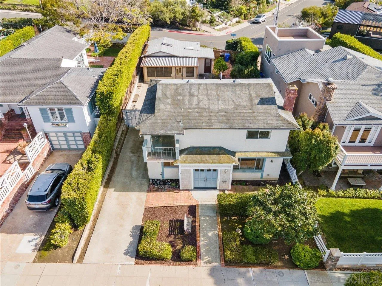 1221 Virginia Way La Jolla, CA 92037 - Photo 2 of 27 an aerial view of a house with a swimming pool