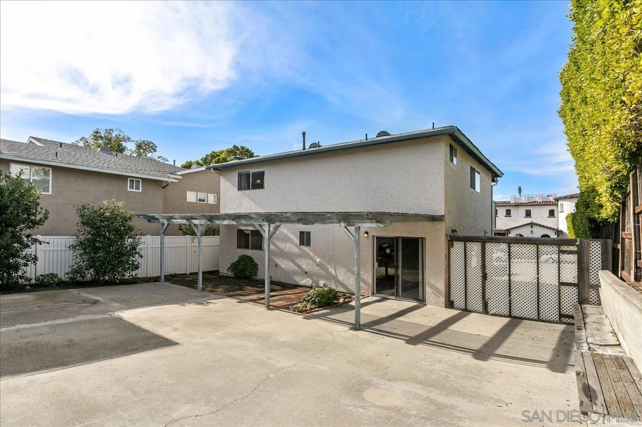 1221 Virginia Way La Jolla, CA 92037 - Photo 23 of 27 a view of a house with backyard porch and sitting area