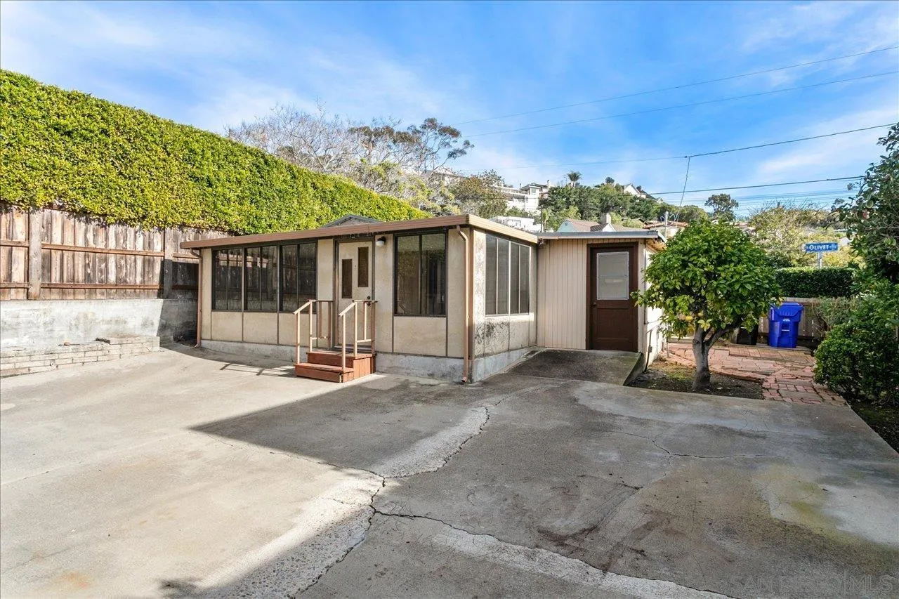 1221 Virginia Way La Jolla, CA 92037 - Photo 25 of 27 a view of a house with backyard and porch