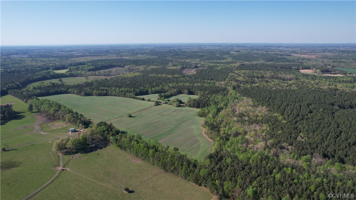 2293 Chalk Level Road, Unit OFF Alberta, VA 23821 - Photo 26 of 50 an aerial view of green landscape with trees houses and mountain view