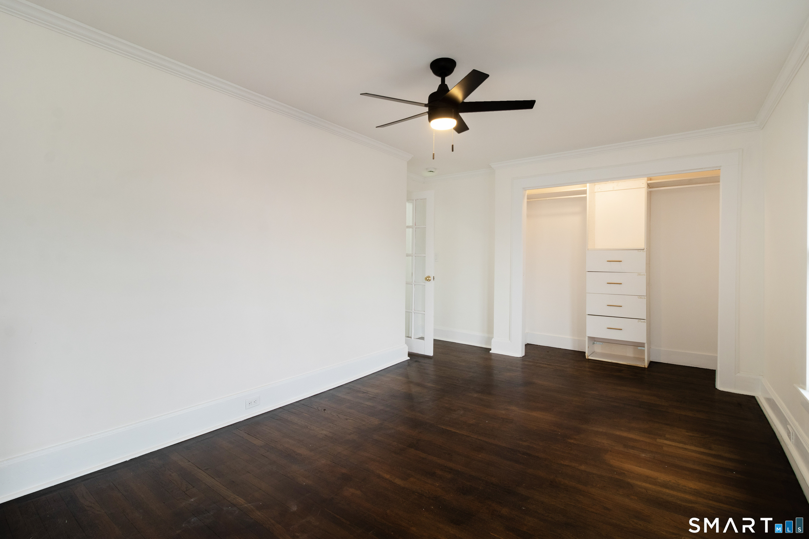 33 Julian Terrace Norwich, CT 06360 - Photo 16 of 36 a view of empty room with wooden floor and fan