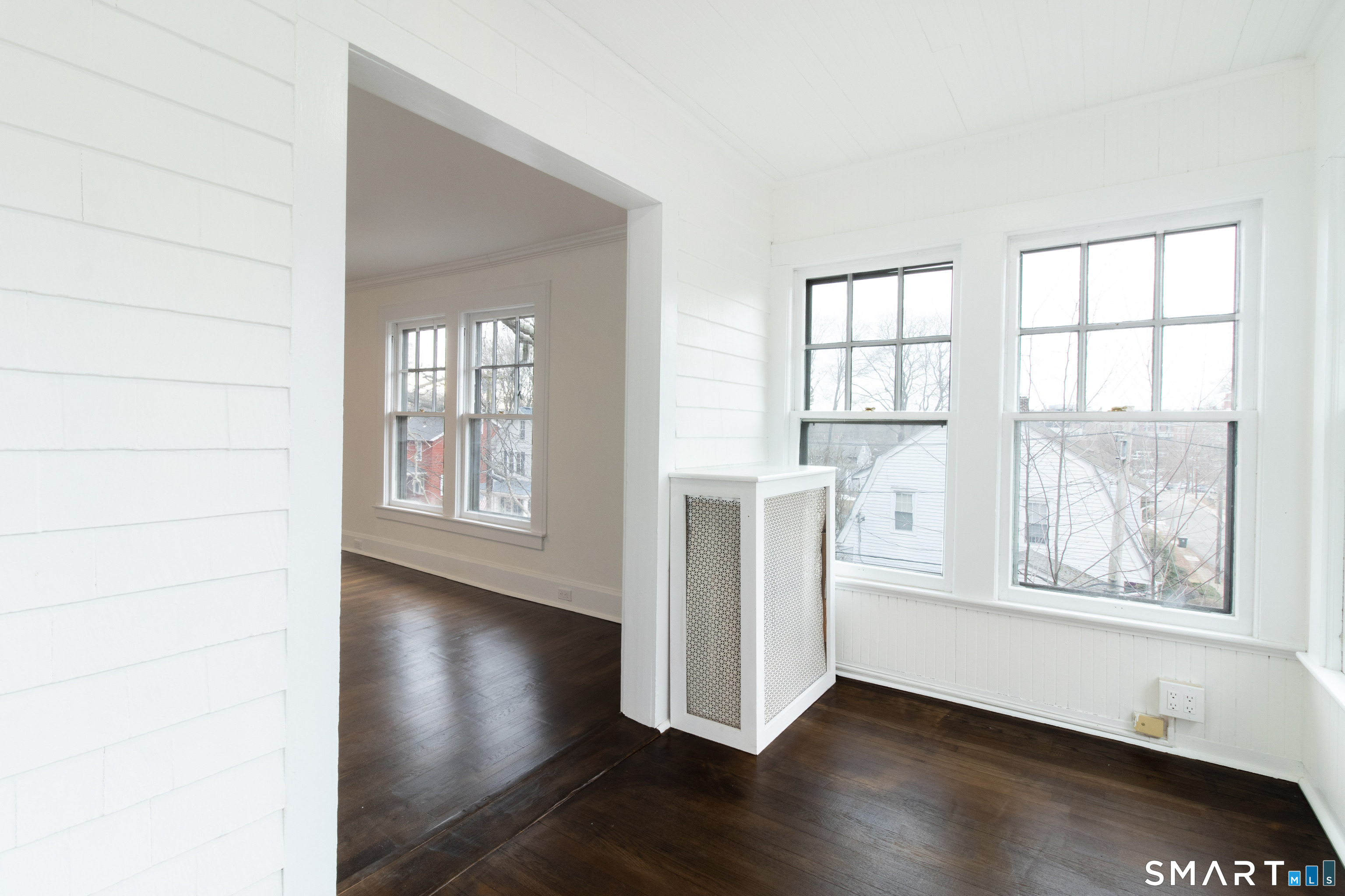 33 Julian Terrace Norwich, CT 06360 - Photo 20 of 36 an empty room with wooden floor and windows