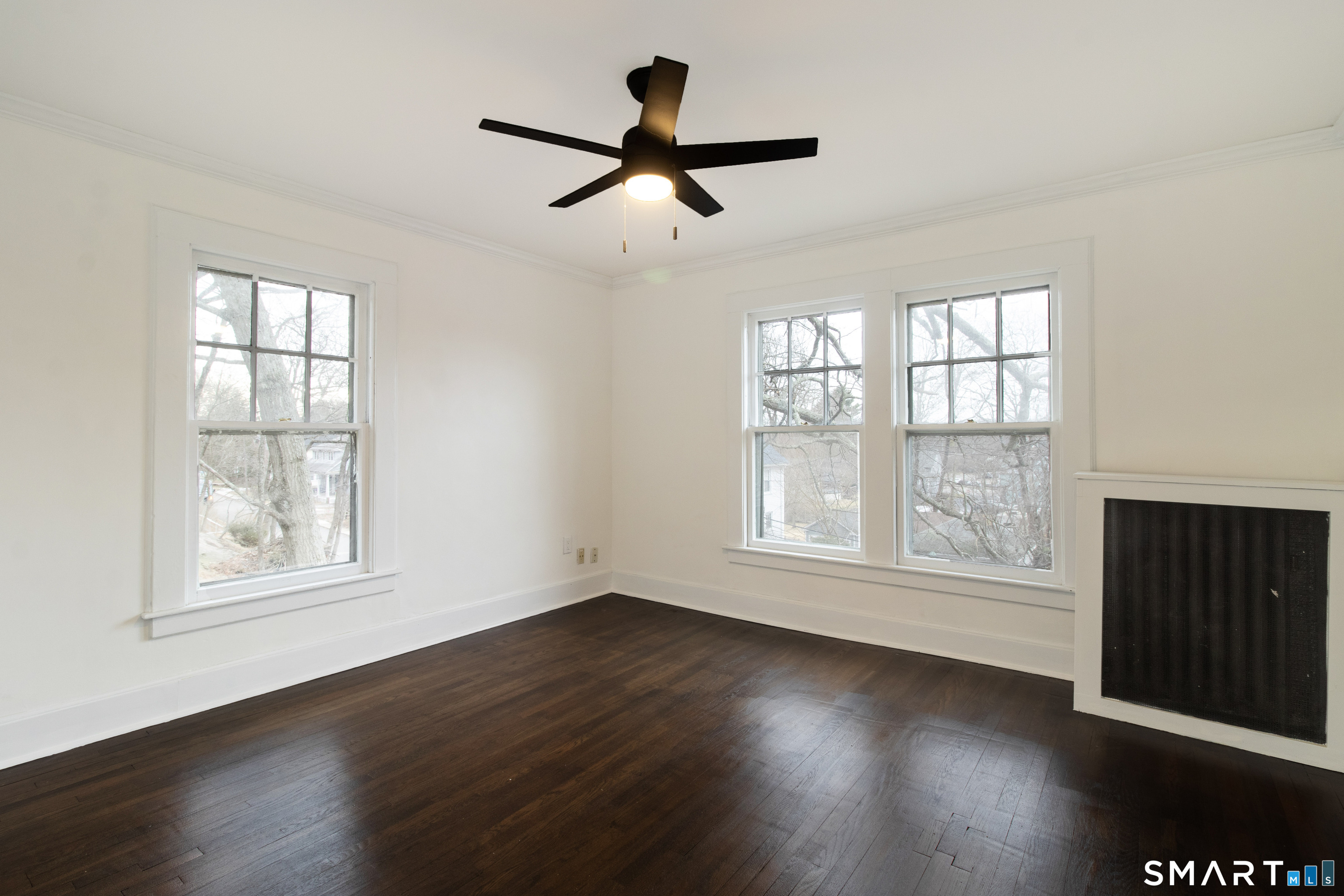 33 Julian Terrace Norwich, CT 06360 - Photo 21 of 36 a view of empty room with wooden floor and fan