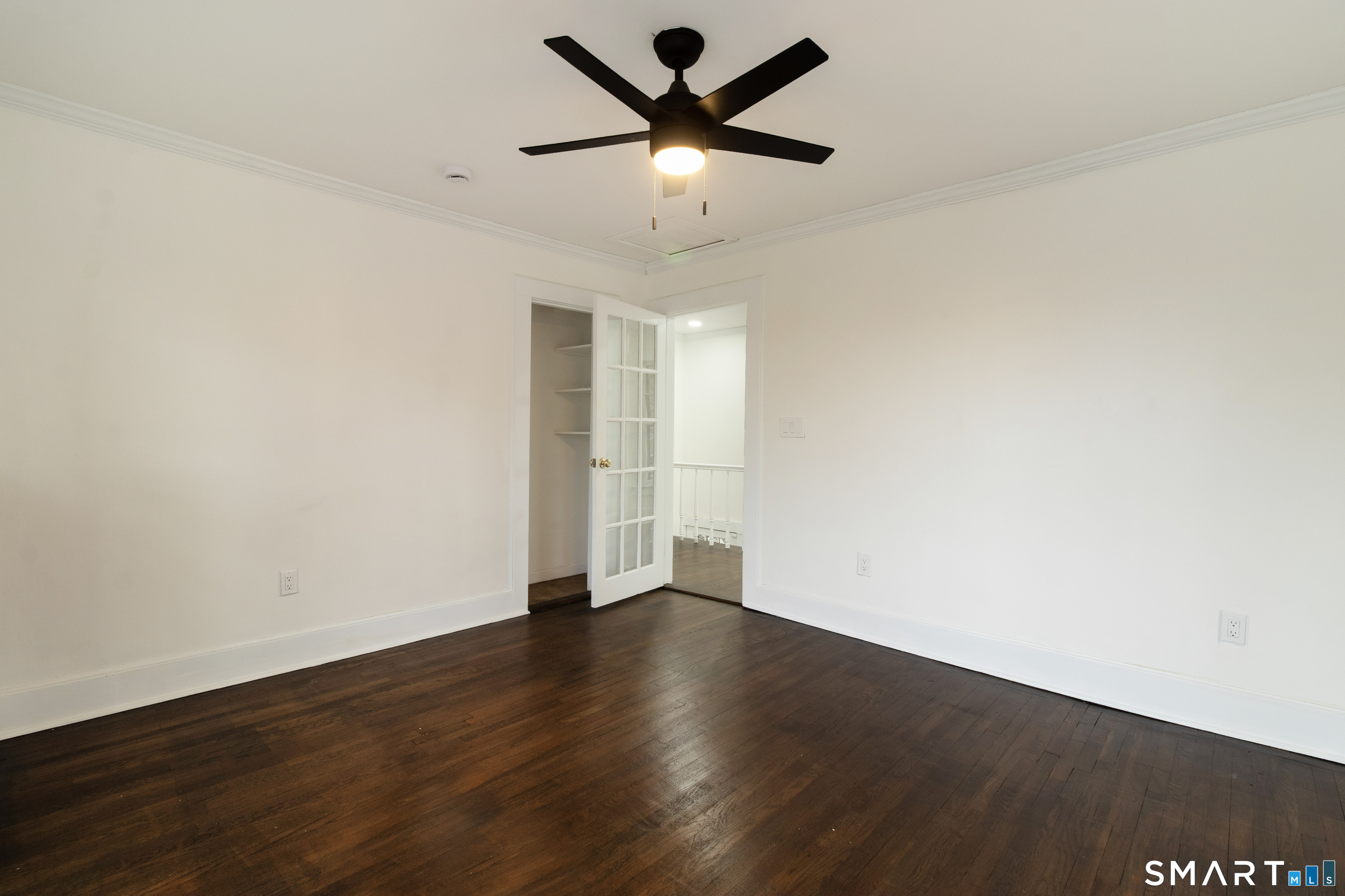 33 Julian Terrace Norwich, CT 06360 - Photo 22 of 36 a view of an empty room with window and wooden floor