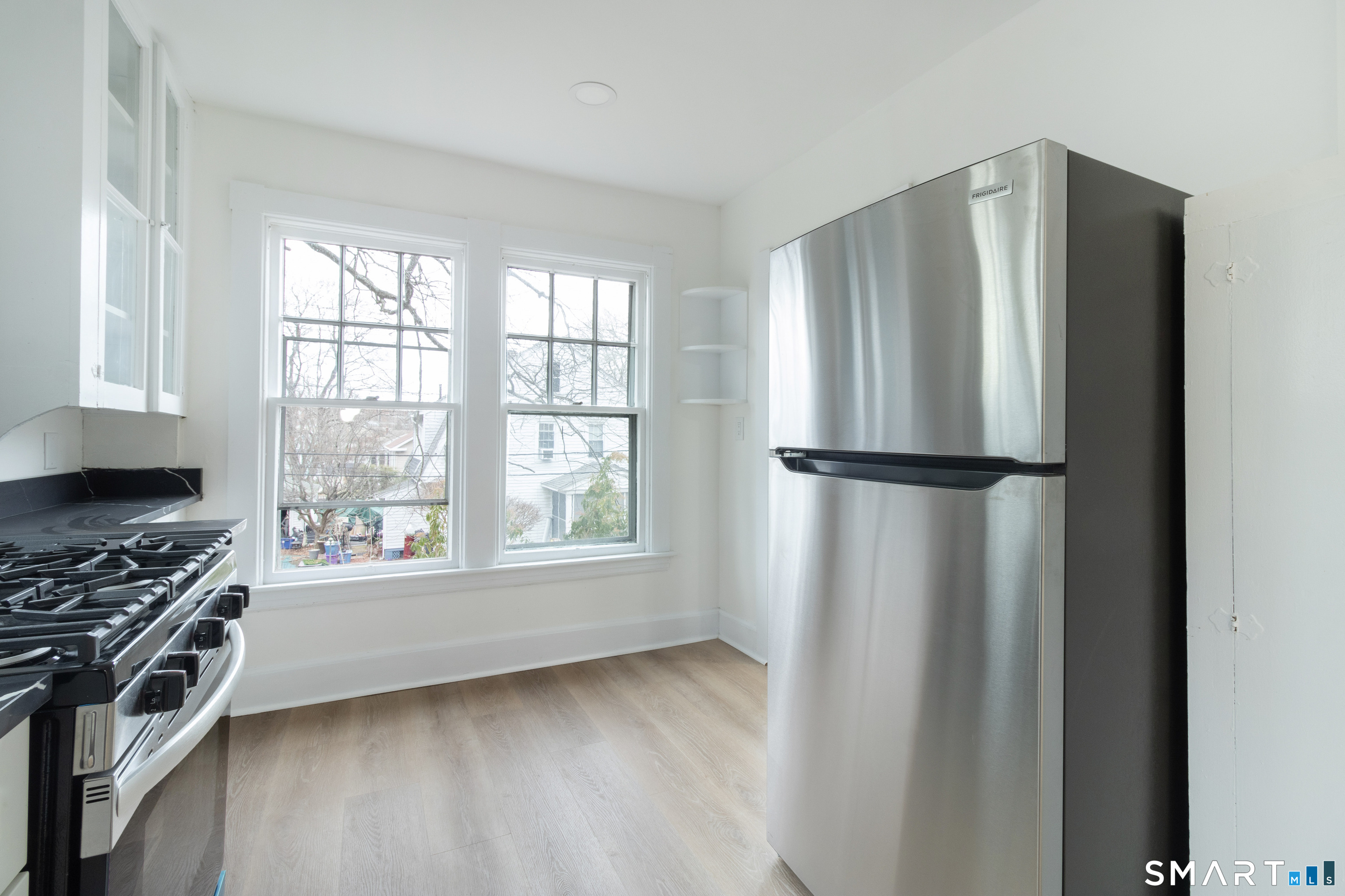 33 Julian Terrace Norwich, CT 06360 - Photo 27 of 36 a kitchen with stainless steel appliances granite countertop a refrigerator and a stove top oven