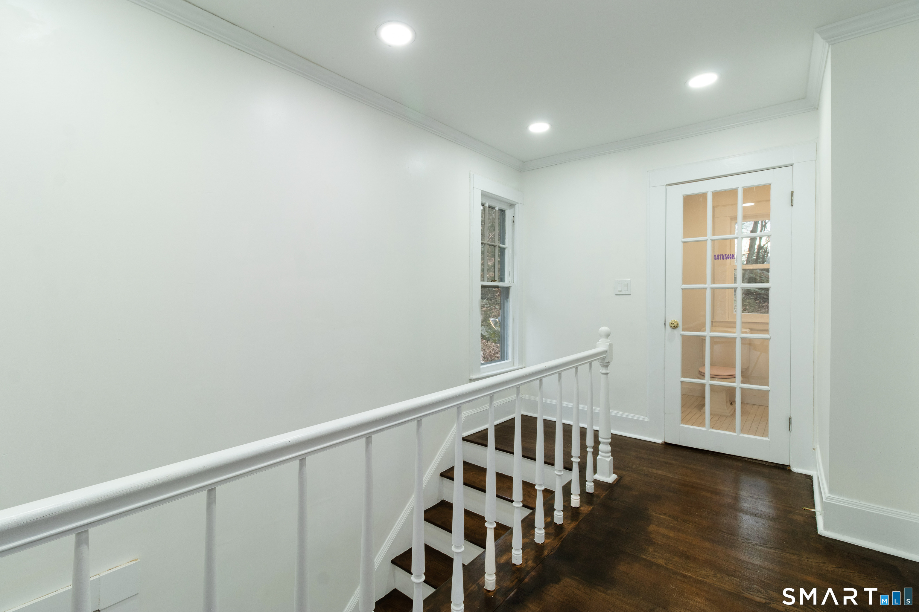 33 Julian Terrace Norwich, CT 06360 - Photo 10 of 36 a view of a hallway with wooden floor and windows