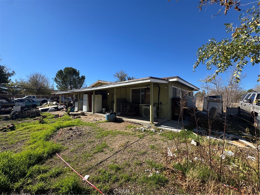 10175 Valle Vista Road Phelan, CA 92371 - Photo 2 of 27 a view of a house with backyard and sitting area