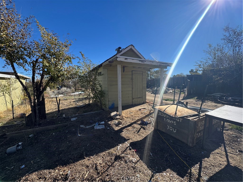 10175 Valle Vista Road Phelan, CA 92371 - Photo 22 of 27 a view of backyard with outdoor seating
