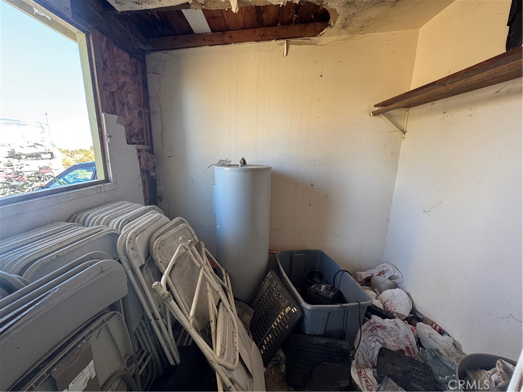 10175 Valle Vista Road Phelan, CA 92371 - Photo 25 of 27 a bedroom with a bed and a window