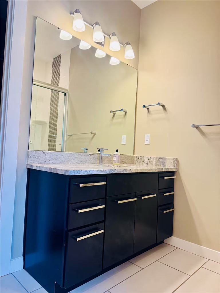 14310 Ridley Way Corpus Christi, TX 78418 - Photo 17 of 19 a bathroom with a sink and a mirror