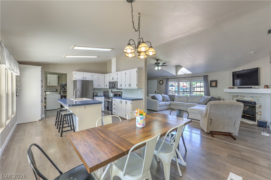 348 Tres Palomas Street Overton, NV 89040 - Photo 13 of 41 An open concept design seamlessly connects the kitchen and living area, perfect for modern living.