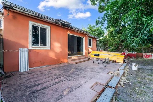 a backyard of a house with seating space