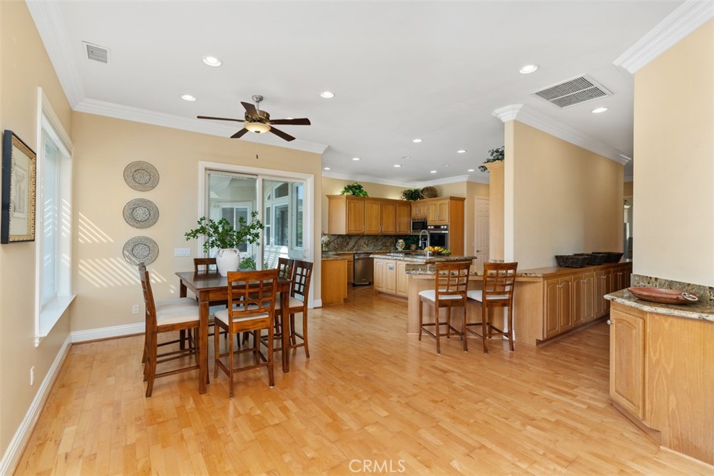 23505 Carancho Road Temecula, CA 92590 - Photo 13 of 73 a view of a dining room with furniture and chandelier