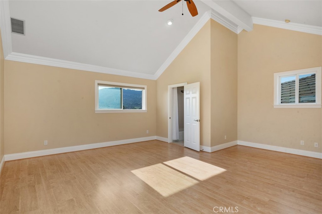 23505 Carancho Road Temecula, CA 92590 - Photo 35 of 73 an empty room with wooden floor and windows