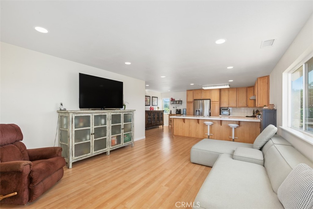 23505 Carancho Road Temecula, CA 92590 - Photo 51 of 73 a living room with furniture and a flat screen tv
