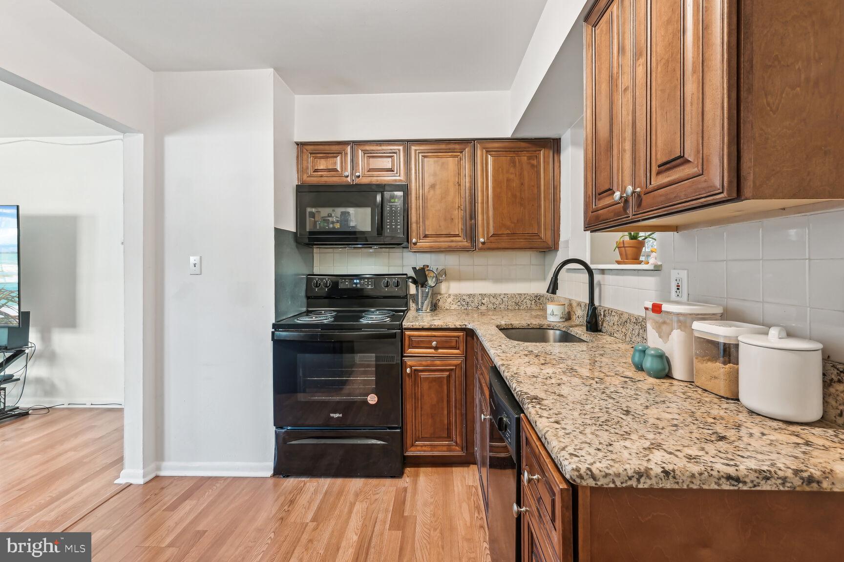 430 Richey Avenue, Unit 1A Oaklyn, NJ 08107 - Photo 5 of 13 Modern kitchen with warm wood accents.