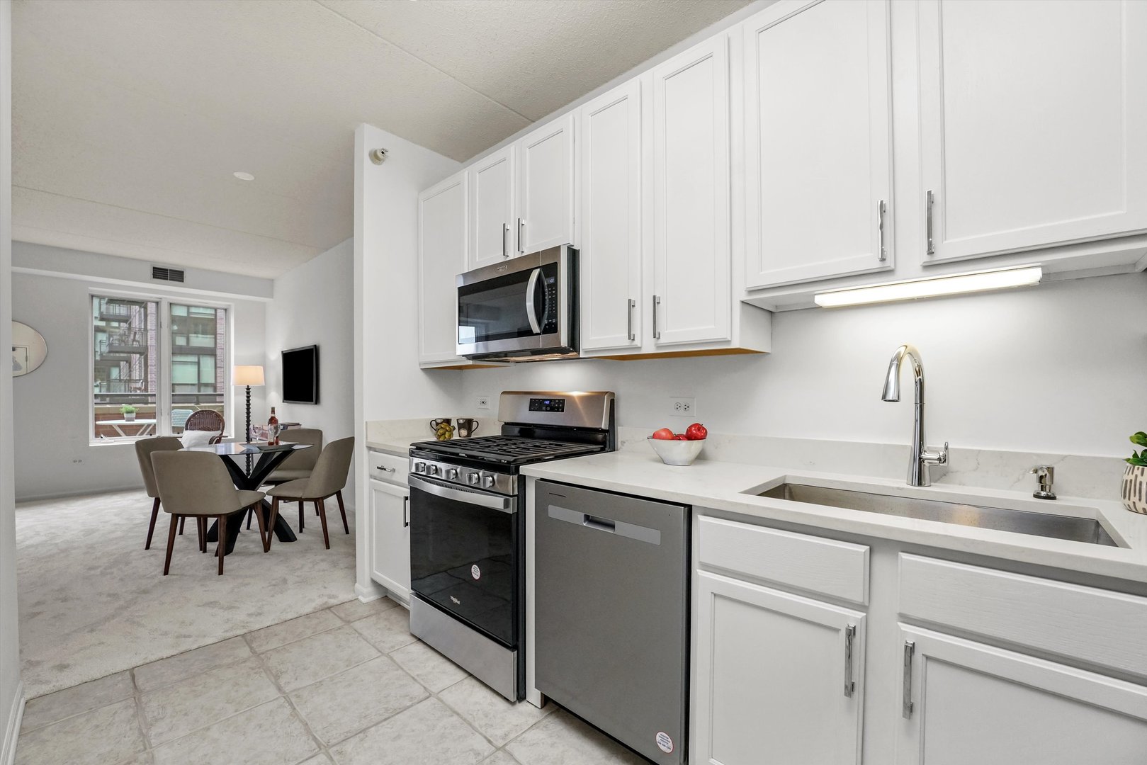 515 Main Street, Unit 307 Evanston, IL 60202 - Photo 6 of 29 a kitchen with appliances cabinets and a sink