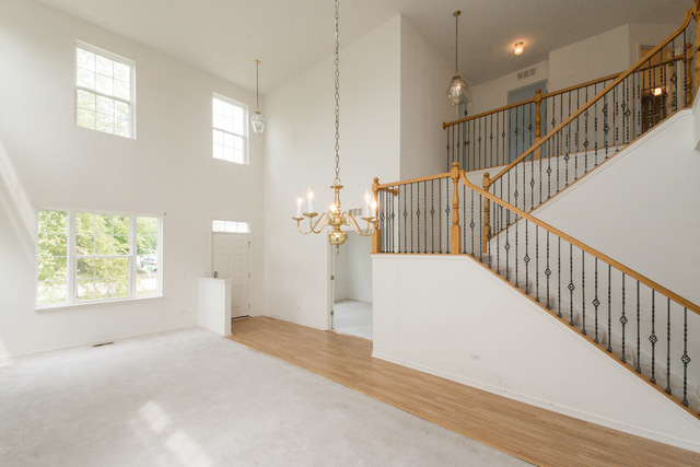 1605 Manhattan Street Bolingbrook, IL 60490 - Photo 11 of 29 a view of a hallway with windows