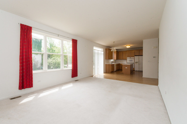 1605 Manhattan Street Bolingbrook, IL 60490 - Photo 14 of 29 a view of empty room with a window and kitchen view