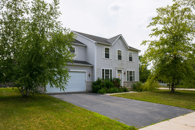 1605 Manhattan Street Bolingbrook, IL 60490 - Photo 2 of 29 a front view of a house with a yard and a garage
