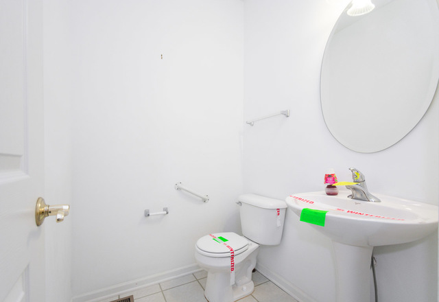 1605 Manhattan Street Bolingbrook, IL 60490 - Photo 21 of 29 a bathroom with a sink mirror and toilet
