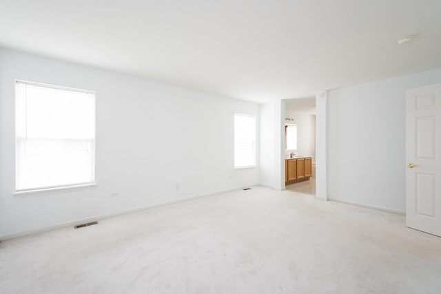 1605 Manhattan Street Bolingbrook, IL 60490 - Photo 22 of 29 an empty room with windows