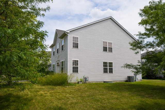1605 Manhattan Street Bolingbrook, IL 60490 - Photo 4 of 29 a view of house with backyard