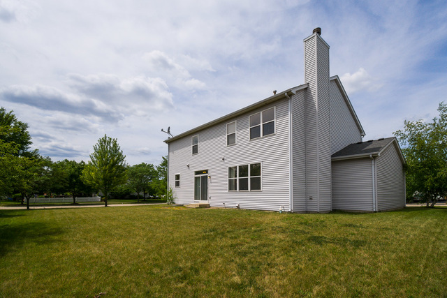 1605 Manhattan Street Bolingbrook, IL 60490 - Photo 7 of 29 a view of a house with a backyard