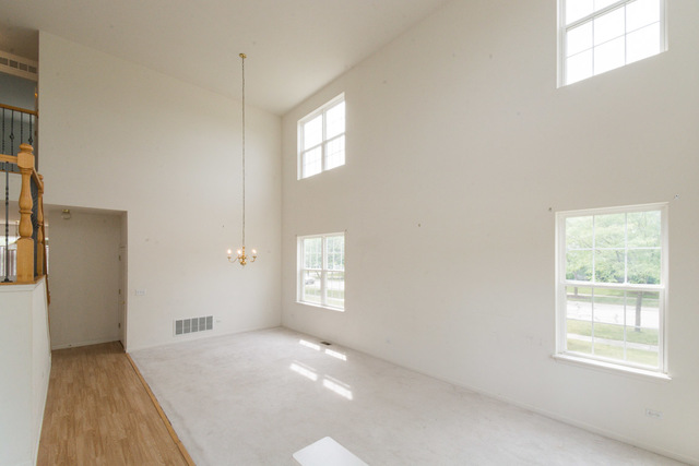 1605 Manhattan Street Bolingbrook, IL 60490 - Photo 8 of 29 a view of an empty room and window