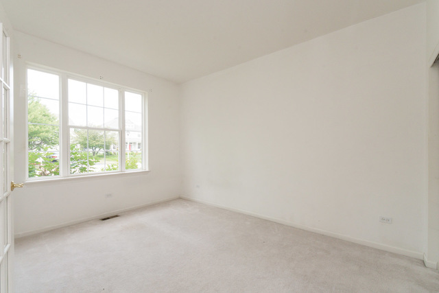 1605 Manhattan Street Bolingbrook, IL 60490 - Photo 10 of 29 an empty room with a window