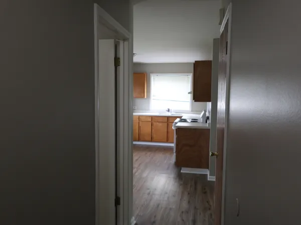 a kitchen with kitchen island a sink appliances and cabinets