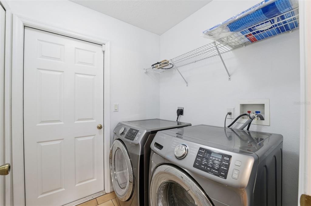 13477 Amanda Avenue Spring Hill, FL 34609 - Photo 23 of 46 a utility room with dryer and washer