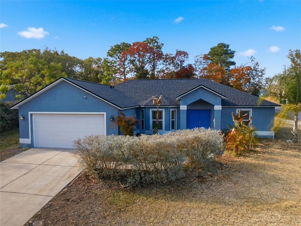 13477 Amanda Avenue Spring Hill, FL 34609 - Photo 31 of 46 a front view of a house with a yard