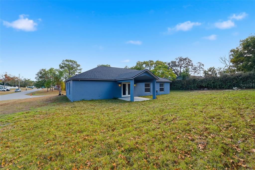 13477 Amanda Avenue Spring Hill, FL 34609 - Photo 35 of 46 a house with garden in front of it