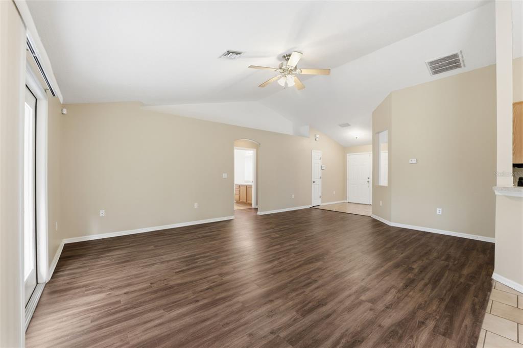 13477 Amanda Avenue Spring Hill, FL 34609 - Photo 37 of 46 an empty room with wooden floor and fan