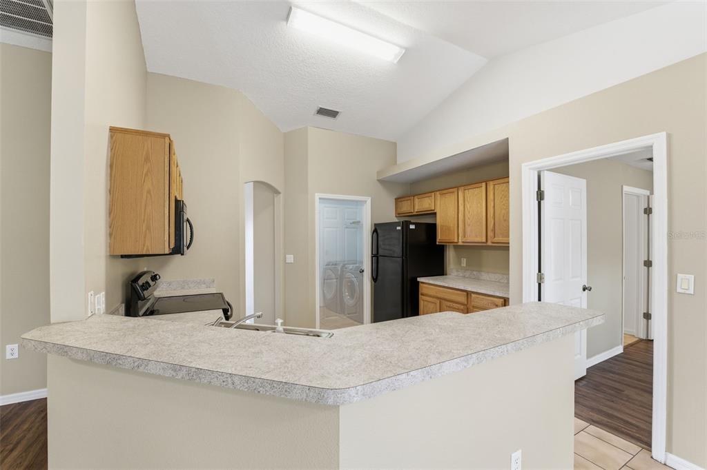 13477 Amanda Avenue Spring Hill, FL 34609 - Photo 39 of 46 a large bathroom with a sink and a mirror